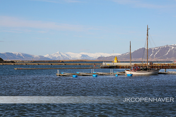 Rekj Day harbor mountains sailboat